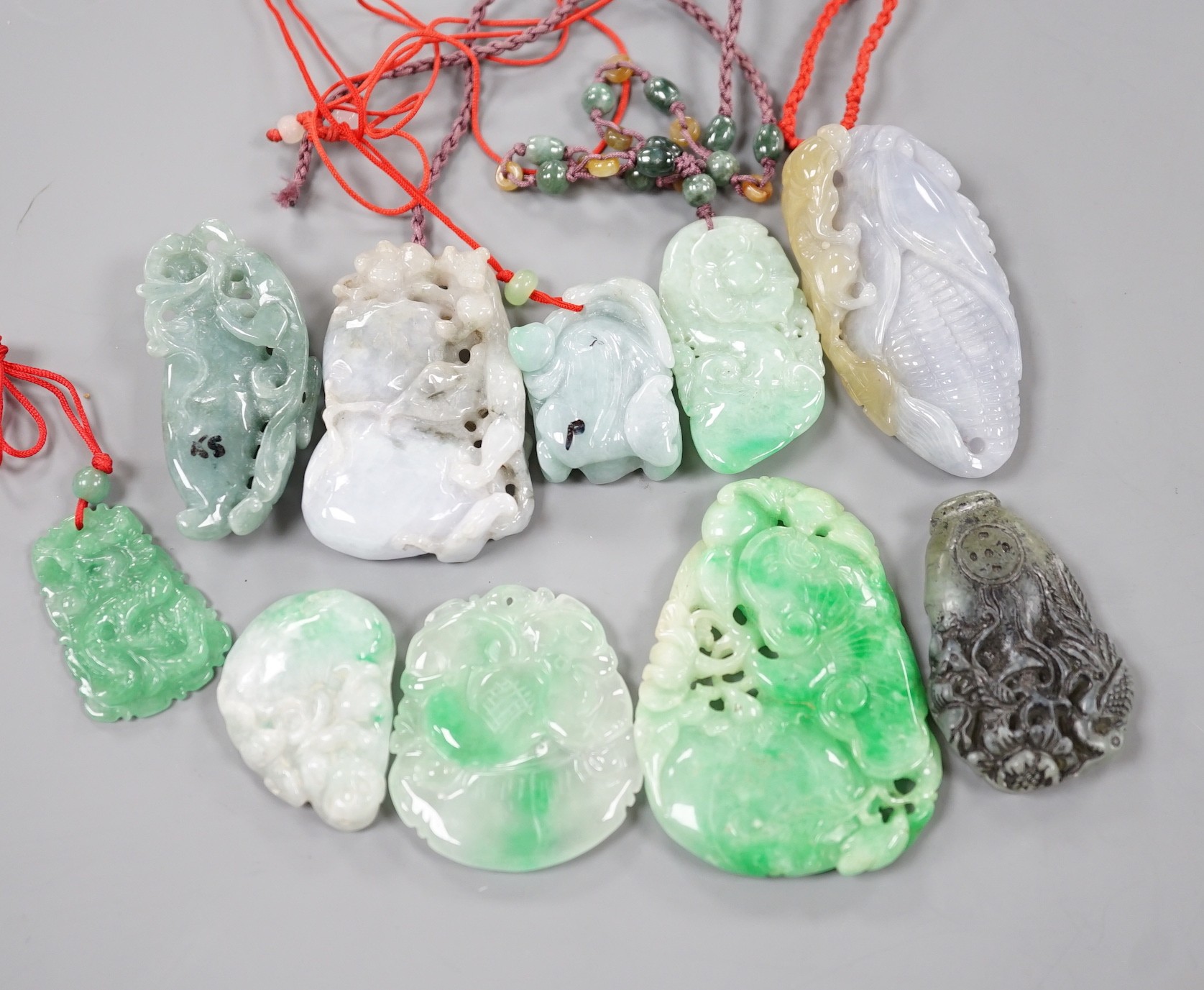 A group of ten jadeite and hardstone carvings and pendants